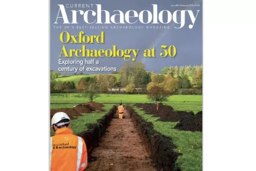 Cover of Current Archaeology issue 407 with a member of the OA team 